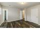 Spacious bedroom with wood floors, neutral walls, and ample closet space at 5998 Radford Dr, Riverdale, GA 30296