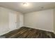 This bedroom boasts durable flooring, neutral walls, and white doors at 5998 Radford Dr, Riverdale, GA 30296