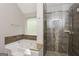 Bright bathroom showcasing a separate shower and tub with tile surround at 7481 Absinth Dr, Atlanta, GA 30349