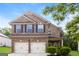 Beautiful two-story brick home with a two-car garage and well-maintained landscaping at 7481 Absinth Dr, Atlanta, GA 30349