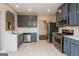 Modern kitchen featuring stainless steel appliances, gray cabinets, and white countertops at 7481 Absinth Dr, Atlanta, GA 30349