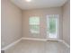 Sun room with tile flooring, a window, and a glass door leading to the outside at 7481 Absinth Dr, Atlanta, GA 30349