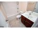 Bathroom featuring a white tub and shower combo, a toilet, and a dark wood vanity at 1015 Buckeye Ln, Villa Rica, GA 30180