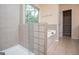 A view of shower stall and soaking tub with tile surround in the bathroom at 1015 Buckeye Ln, Villa Rica, GA 30180