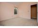 Bedroom featuring neutral carpet, large window, and light peach-painted walls at 1015 Buckeye Ln, Villa Rica, GA 30180