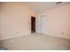 Bedroom featuring neutral carpet and light peach-painted walls at 1015 Buckeye Ln, Villa Rica, GA 30180