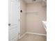 Walk-in closet with white wire shelving and neutral carpeted flooring at 1015 Buckeye Ln, Villa Rica, GA 30180