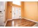 Inviting foyer featuring elegant hardwood flooring and a stylish front door with decorative glass at 1015 Buckeye Ln, Villa Rica, GA 30180