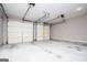 Spacious two-car garage with bright lighting and concrete flooring at 1015 Buckeye Ln, Villa Rica, GA 30180