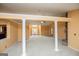 Spacious living room with carpet, columns, and fireplace open to entryway at 1015 Buckeye Ln, Villa Rica, GA 30180