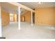 Bright living room featuring columns, fireplace, high ceilings, and neutral carpet at 1015 Buckeye Ln, Villa Rica, GA 30180