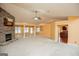 Expansive living room featuring a stone fireplace and views into kitchen, perfect for gatherings at 1015 Buckeye Ln, Villa Rica, GA 30180