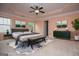 Staged main bedroom featuring tray ceilings and carpeted floors at 1015 Buckeye Ln, Villa Rica, GA 30180