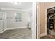 Bright bathroom features wood-look flooring, shower, and white vanity with a window at 1427 Timms Se Cir, Atlanta, GA 30316