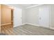 This bedroom features wood-look flooring with access to two separate rooms at 1427 Timms Se Cir, Atlanta, GA 30316