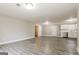 Expansive living room with wood-look floors, featuring a well-lit and open layout at 1427 Timms Se Cir, Atlanta, GA 30316