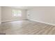 Bright and airy living room with luxury vinyl plank floors and fresh paint at 1427 Timms Se Cir, Atlanta, GA 30316