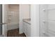 Bathroom featuring granite countertops, white cabinetry, and a shower and tub combination at 240 Oliver Dr, Locust Grove, GA 30248