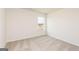 Bright carpeted bedroom with a view from the window at 240 Oliver Dr, Locust Grove, GA 30248