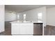 Bright kitchen featuring stainless steel appliances, a granite island, and an open layout at 240 Oliver Dr, Locust Grove, GA 30248
