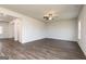 Spacious living room featuring hardwood flooring, neutral walls, and modern ceiling fan at 240 Oliver Dr, Locust Grove, GA 30248