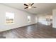 Open concept living room with lots of natural light, and hardwood flooring leading into kitchen at 240 Oliver Dr, Locust Grove, GA 30248