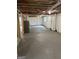 Spacious unfinished basement with concrete floor, water heater, and exposed ceiling at 132 N Johnson St, Bowdon, GA 30108