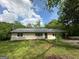 Charming single-story home with freshly cut lawn and mature landscaping at 132 N Johnson St, Bowdon, GA 30108