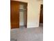 Bedroom with closet and neutral carpeting at 8672 Bowden St, Douglasville, GA 30134