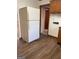 Functional kitchen featuring a large white refrigerator and wood-look vinyl flooring at 8672 Bowden St, Douglasville, GA 30134