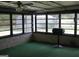 Enclosed sunroom with lots of windows and grill for outdoor cooking at 8672 Bowden St, Douglasville, GA 30134