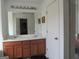 Bathroom featuring a double sink vanity with a large mirror and lighting at 4832 Batiste Ln, Acworth, GA 30101