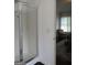 Modern bathroom with glass-enclosed shower and view into bedroom at 4832 Batiste Ln, Acworth, GA 30101