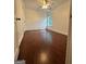 Bedroom featuring hardwood floors and natural light from a window at 4832 Batiste Ln, Acworth, GA 30101
