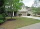 Beautiful home featuring a lush front yard, stone accents, and a two-car garage at 4832 Batiste Ln, Acworth, GA 30101