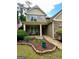 Charming front yard with stone pathway and landscaping, leading to the front entrance at 4832 Batiste Ln, Acworth, GA 30101