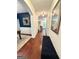 Inviting hallway with hardwood floors and elegant décor, featuring staircase to upper level at 4832 Batiste Ln, Acworth, GA 30101