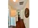 Bright hallway with hardwood floors, white walls, and decorative wall art at 4832 Batiste Ln, Acworth, GA 30101