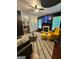 Cozy living room with fireplace, modern decor, and open layout with a view of the kitchen at 4832 Batiste Ln, Acworth, GA 30101