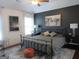 Bedroom with a tray ceiling, an accent wall, stylish decor, and a comfortable bed at 4832 Batiste Ln, Acworth, GA 30101