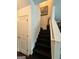 Stairway with white walls, black stairs and a modern design with an accent painting at 4832 Batiste Ln, Acworth, GA 30101