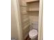 Bathroom with a toilet and a closet with shelving at 8660 Bowden St, Douglasville, GA 30134