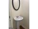 Powder room featuring a pedestal sink and oval mirror at 8660 Bowden St, Douglasville, GA 30134