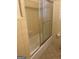 Bathroom featuring a glass shower door and classic tiled walls at 8660 Bowden St, Douglasville, GA 30134