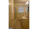 Full bathroom features a shower and tub combo with tiled walls at 8660 Bowden St, Douglasville, GA 30134
