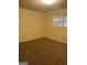 Bedroom with neutral carpet and a window for natural light at 8660 Bowden St, Douglasville, GA 30134