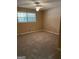Comfortable bedroom with neutral carpet, ceiling fan and a bright, sunny window at 8660 Bowden St, Douglasville, GA 30134