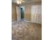 This bedroom includes neutral carpet, spacious closet, access to another room and ceiling fan at 8660 Bowden St, Douglasville, GA 30134