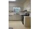 Traditional kitchen with an updated stainless steel oven and ample counter space at 8660 Bowden St, Douglasville, GA 30134