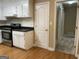 Kitchen featuring white cabinets, stainless steel appliances, and hardwood floors at 8660 Bowden St, Douglasville, GA 30134